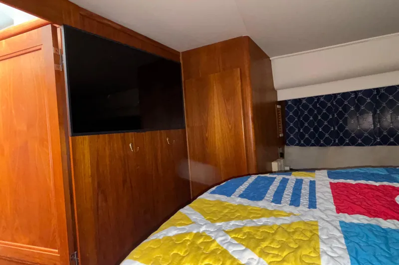 Slide: The Image of Interior of 1993 Carver 350 Voyager yacht with kitchenette and seating area. - 20