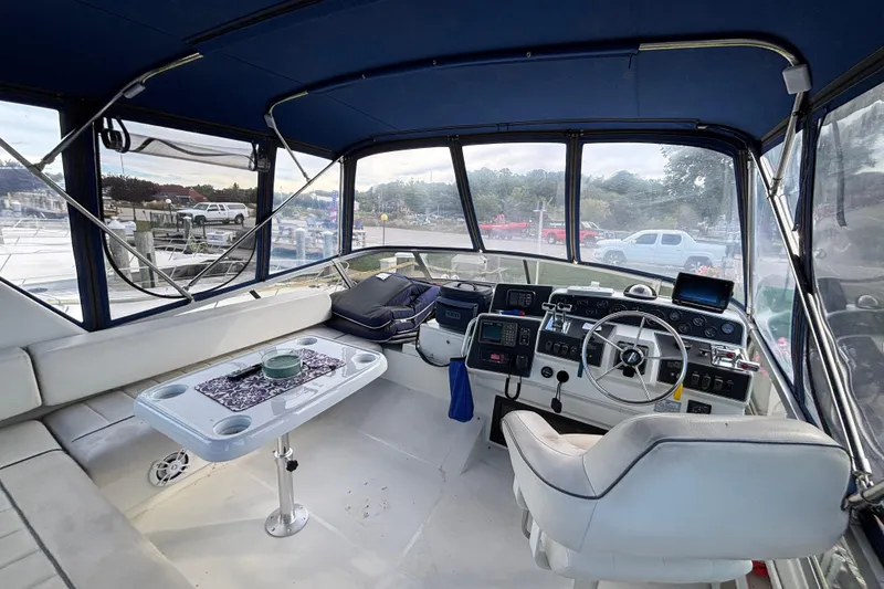 Slide: The Image of Interior of 1993 Carver 350 Voyager boat with seating and control panel. - 29