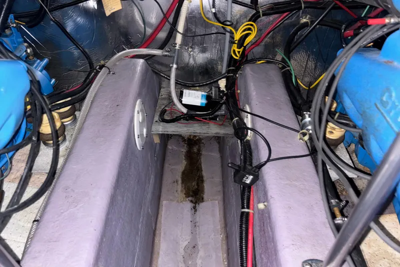 Slide: The Image of Engine compartment of a 1993 Carver 350 Voyager with visible wiring and components. - 44