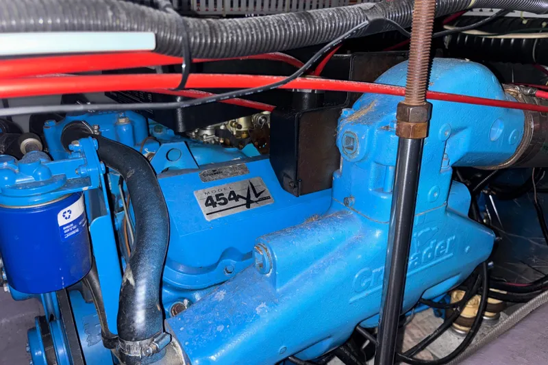 Slide: The Image of Engine of 1993 Carver 350 Voyager boat, featuring Crusader 454XL model. - 46