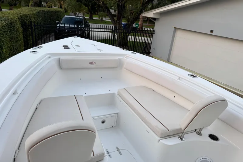 Slide: The Image of 2021 Sea Hunt Gamefish 25 boat with white seating and spacious deck. - 11