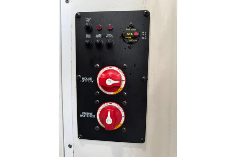 Slide: The Image of Control panel of a 2021 Sea Hunt Gamefish 25 boat, featuring battery switches. - 17