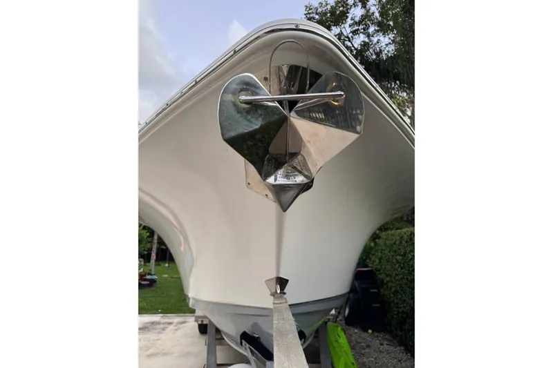 Slide: The Image of 2021 Sea Hunt Gamefish 25 boat with stainless steel anchor, viewed from the front. - 20