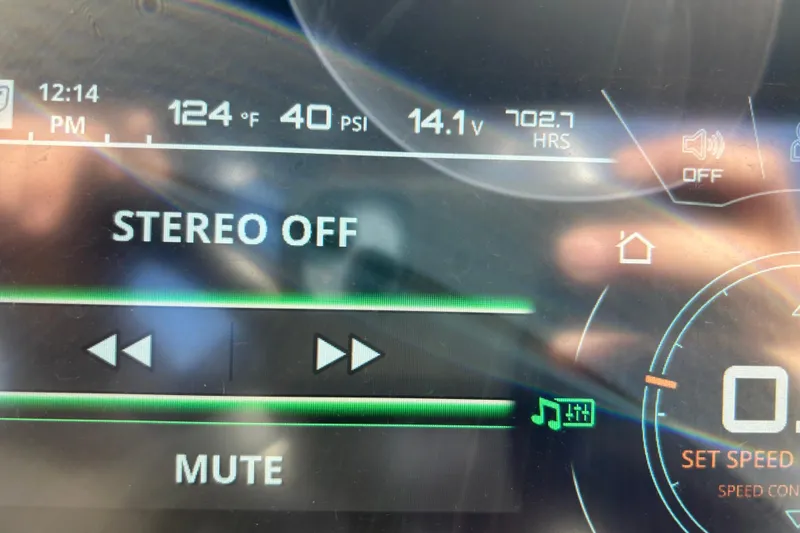 Slide: The Image of Close-up of 2017 Nautique Super Air Nautique G23 dashboard display showing stereo off and system metrics. - 8