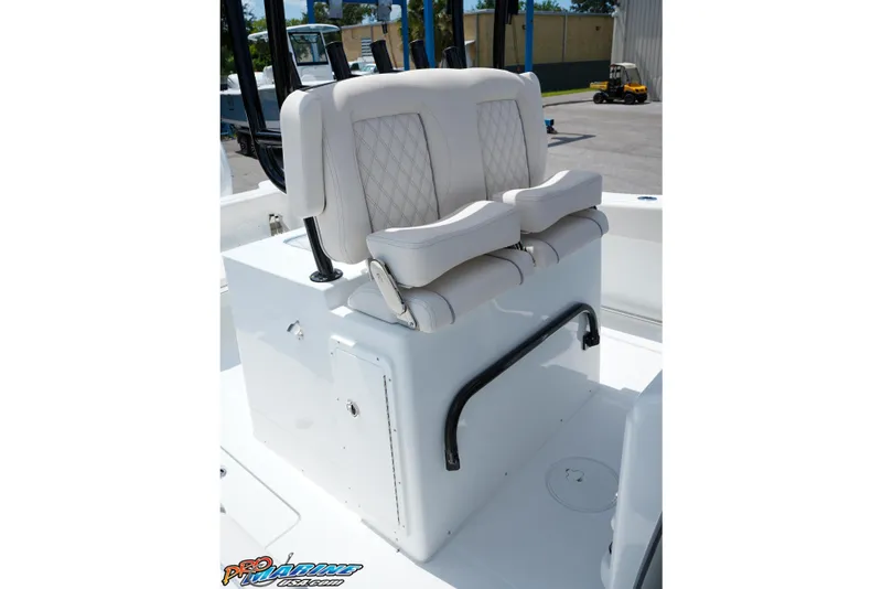 Slide: The Image of 2026 Sea Hunt Gamefish 30 Coffin Box boat seating with white cushioned seats. - 10