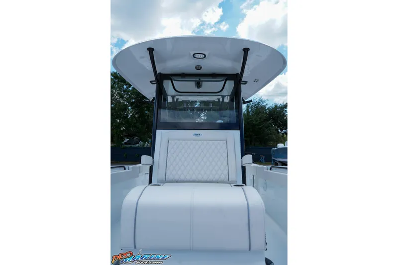 Slide: The Image of 2026 Sea Hunt Gamefish 30 Coffin Box boat interior with cushioned seating and canopy. - 22