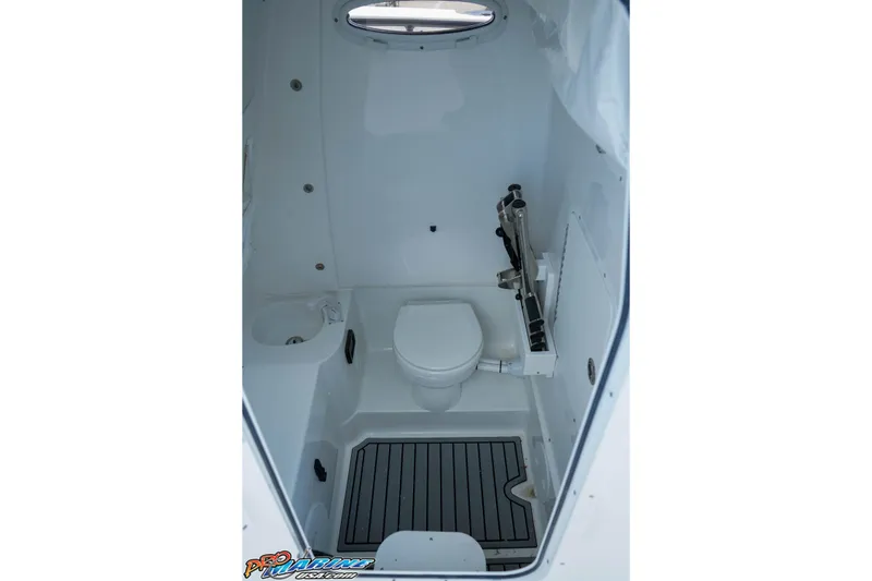 Slide: The Image of 2026 Sea Hunt Gamefish 30 Coffin Box boat interior with toilet and sink. - 23