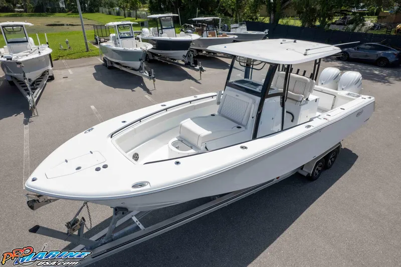 Slide: The Image of 2026 Sea Hunt Gamefish 30 Coffin Box boat on trailer in parking lot. - 29