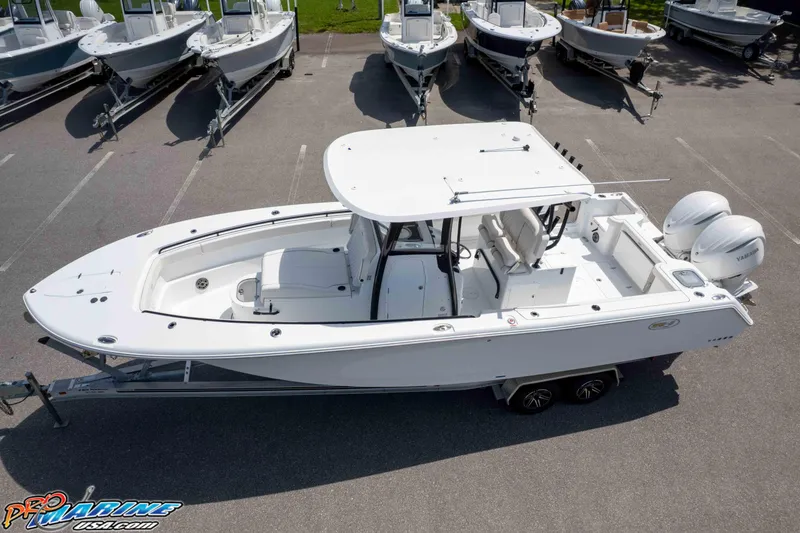 Slide: The Image of 2026 Sea Hunt Gamefish 30 Coffin Box boat with dual engines on trailer. - 35