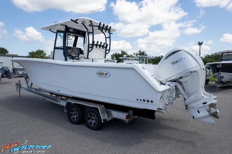 Slide: The Image of 2026 Sea Hunt Gamefish 30 Coffin Box boat with Yamaha engine on trailer. - 37