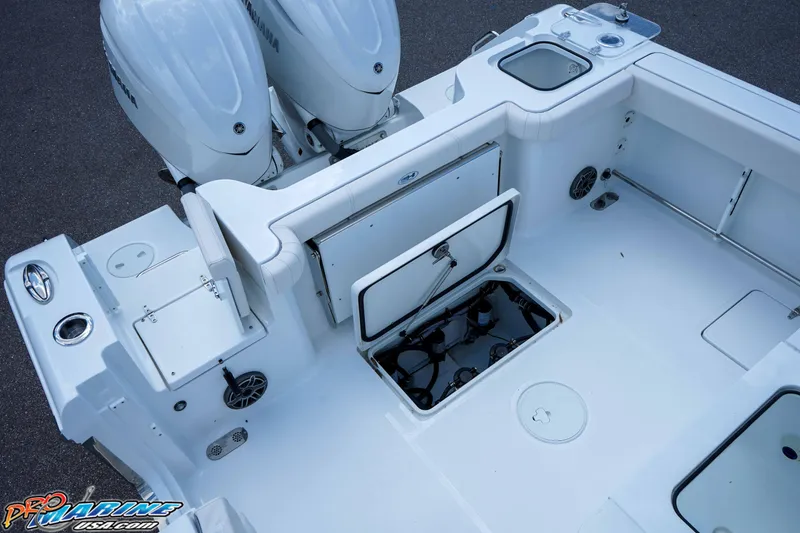 Slide: The Image of 2026 Sea Hunt Gamefish 30 Coffin Box boat interior with open storage compartments. - 4