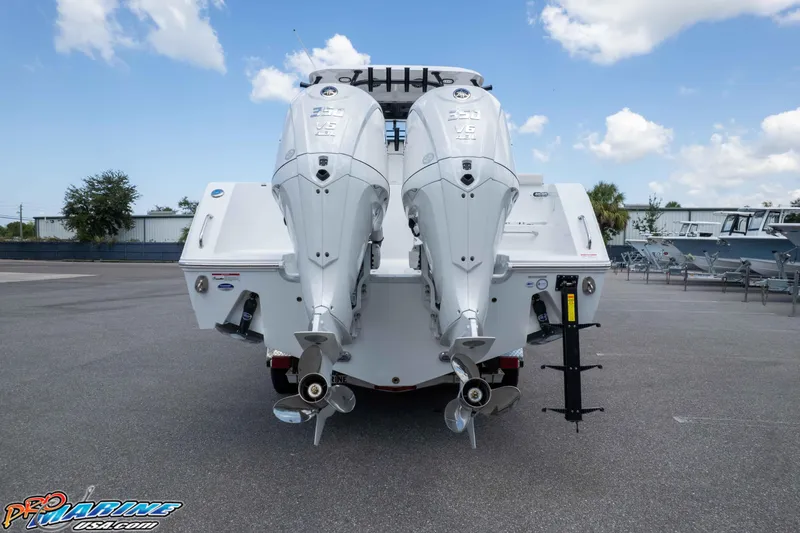 Slide: The Image of 2026 Sea Hunt Gamefish 30 Coffin Box with dual outboard engines, rear view. - 42