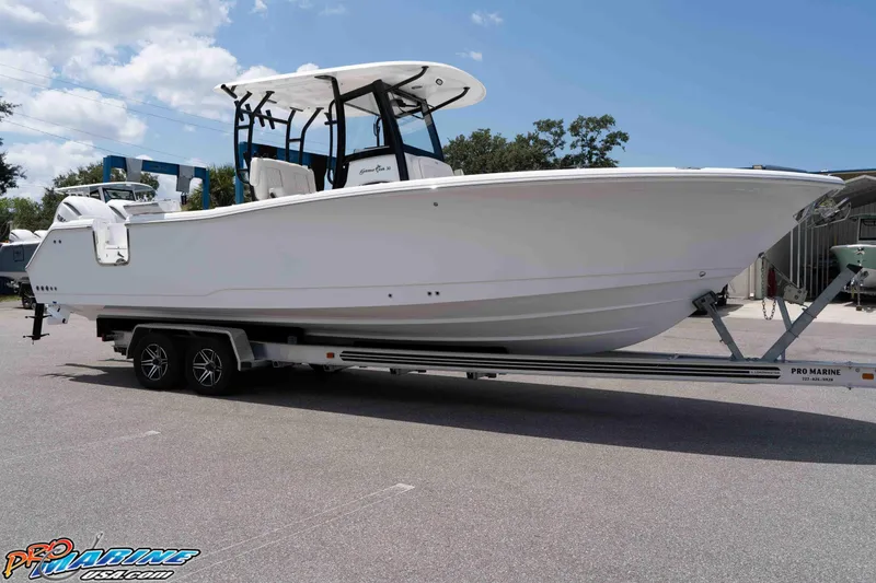 Slide: The Image of 2026 Sea Hunt Gamefish 30 Coffin Box boat on trailer, parked outdoors. - 46