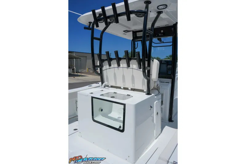 Slide: The Image of 2026 Sea Hunt Gamefish 30 Coffin Box boat interior with rod holders and storage. - 8