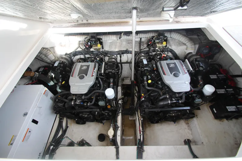 Slide: The Image of Engine compartment of a 2008 Rinker 330 Express Cruiser with dual engines. - 43