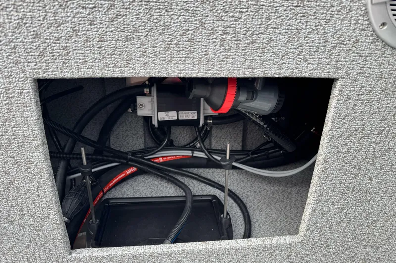 Slide: The Image of Interior view of 2026 Lund 185 Heavy Gauge boat wiring and components. - 17