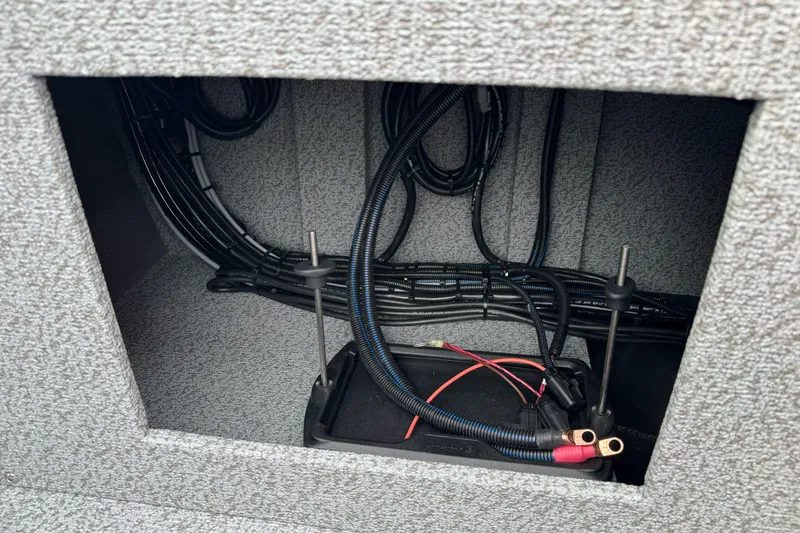 Slide: The Image of Interior wiring of 2026 Lund 185 Heavy Gauge boat, showcasing cables and battery connections. - 18