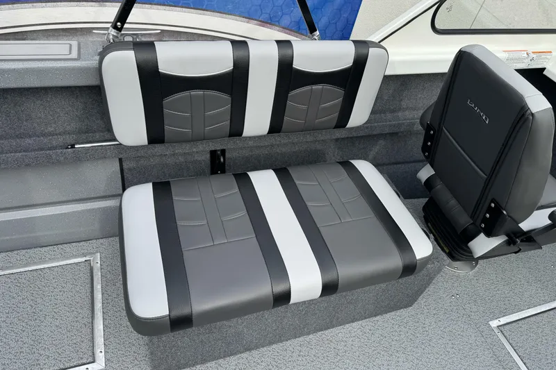 Slide: The Image of 2026 Lund 185 Heavy Gauge boat interior with stylish gray and black seating. - 20