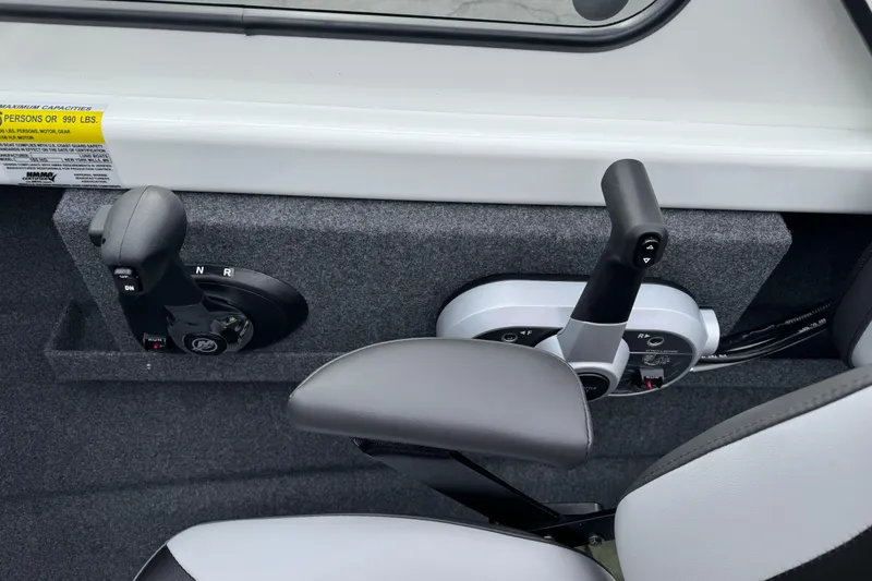 Slide: The Image of 2026 Lund 185 Heavy Gauge boat controls and seating detail. - 28