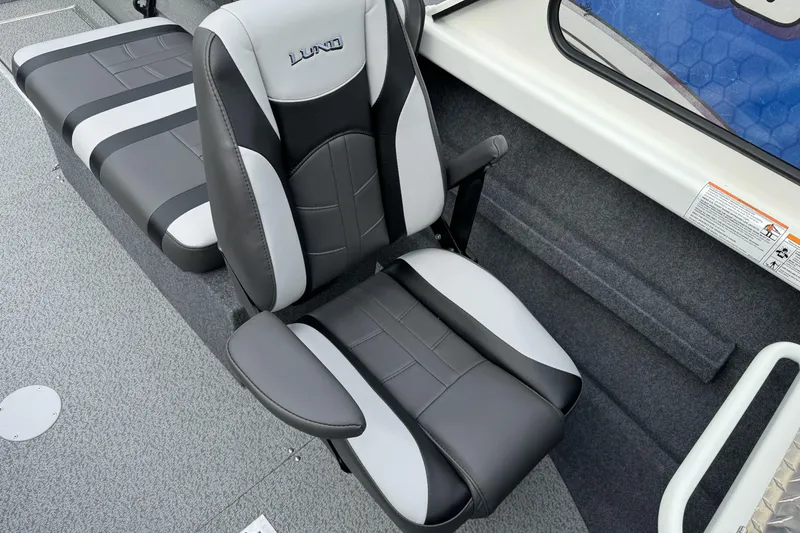 Slide: The Image of 2026 Lund 185 Heavy Gauge boat interior with black and gray seating. - 31