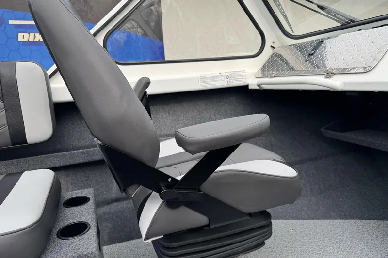 Slide: The Image of 2026 Lund 185 Heavy Gauge boat interior with gray seating and cup holders. - 32