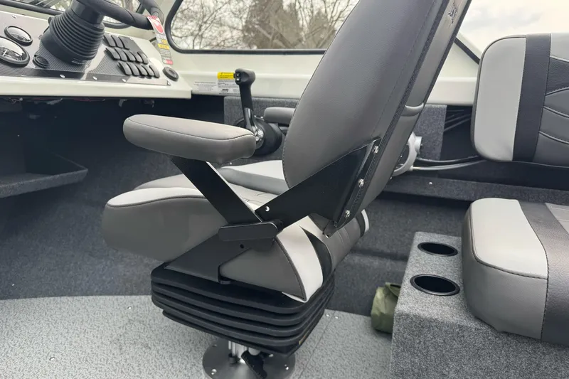 Slide: The Image of Interior of 2026 Lund 185 Heavy Gauge boat with gray seating and control panel. - 33