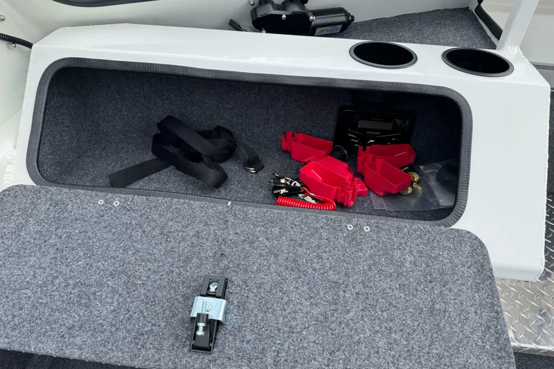 Slide: The Image of Storage compartment in 2026 Lund 185 Heavy Gauge boat with accessories and cup holders. - 37