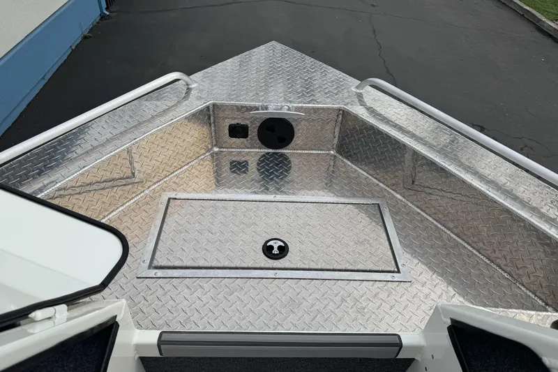 Slide: The Image of 2026 Lund 185 Heavy Gauge boat deck with diamond plate finish. - 38