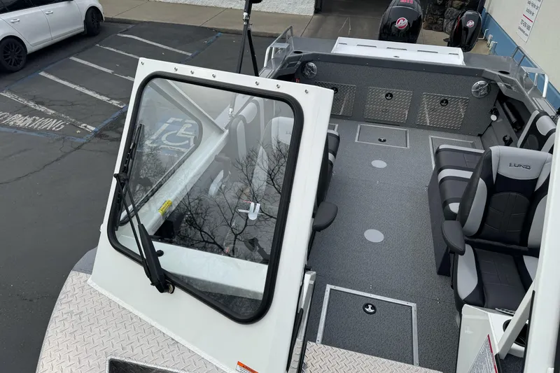 Slide: The Image of 2026 Lund 185 Heavy Gauge boat interior with seating and storage compartments. - 39