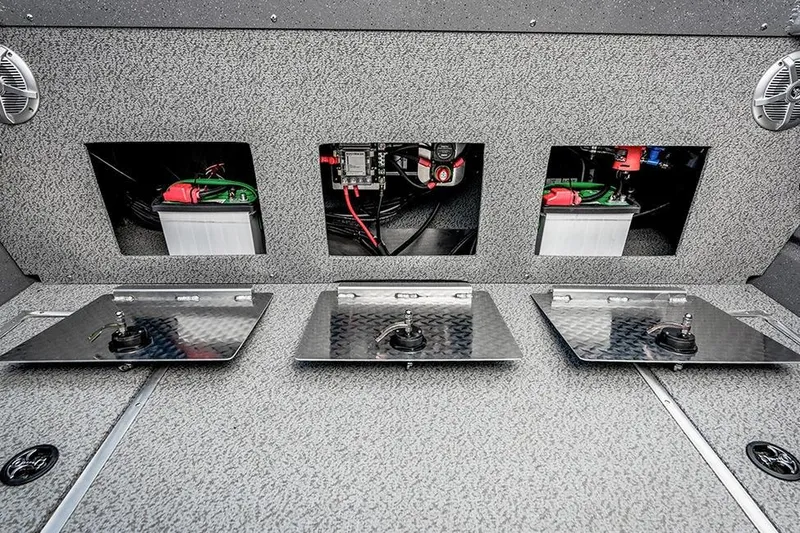 Slide: The Image of Trailer hitch and wheel of 2026 Lund 185 Heavy Gauge boat on pavement. - 7