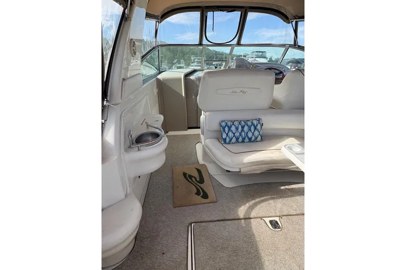 Slide: The Image of Interior of 2000 Sea Ray 310 Sundancer boat with seating and nautical decor. - 6