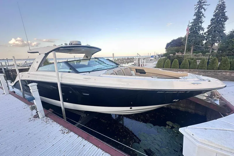 The Image of 2024 Sea Ray SLX 400 boat docked, showcasing sleek design and luxury features. - 0