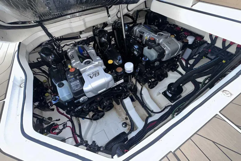 Slide: The Image of Engine compartment of 2024 Sea Ray SLX 400 with dual V8 engines. - 13