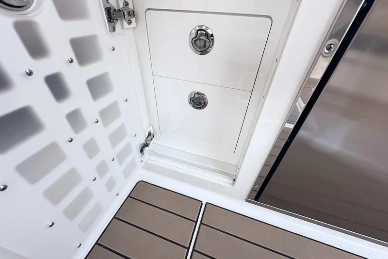 Slide: The Image of 2024 Sea Ray SLX 400 interior storage compartment with sleek design and modern finishes. - 19