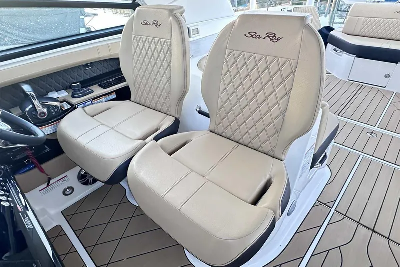Slide: The Image of 2024 Sea Ray SLX 400 interior with luxurious beige seating and modern dashboard. - 25