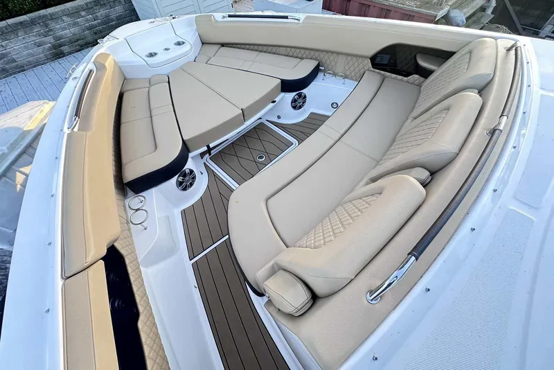 Slide: The Image of Luxurious seating area on 2024 Sea Ray SLX 400 boat with beige upholstery. - 33