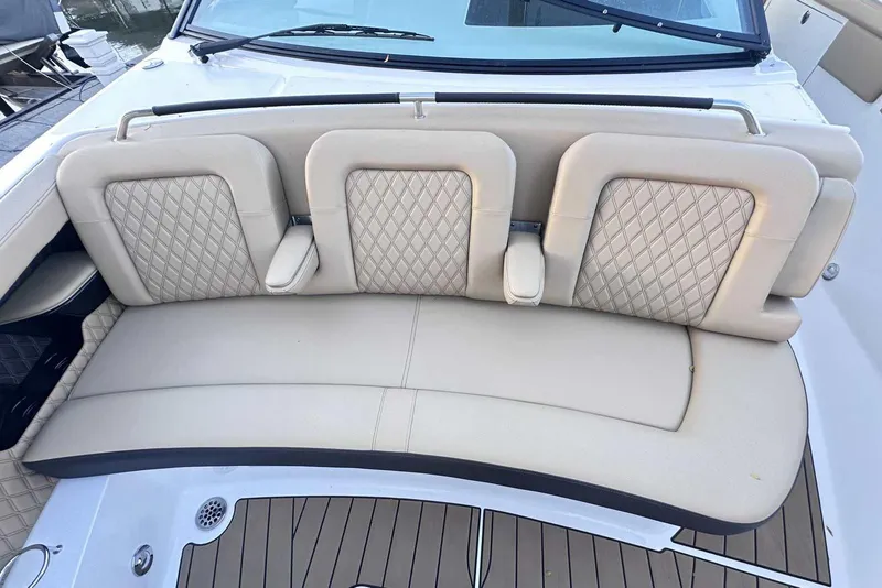 Slide: The Image of 2024 Sea Ray SLX 400 boat with luxurious beige seating and diamond-patterned upholstery. - 34