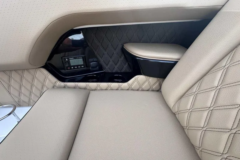 Slide: The Image of Luxurious interior of 2024 Sea Ray SLX 400 with diamond-stitched upholstery and control panel. - 35