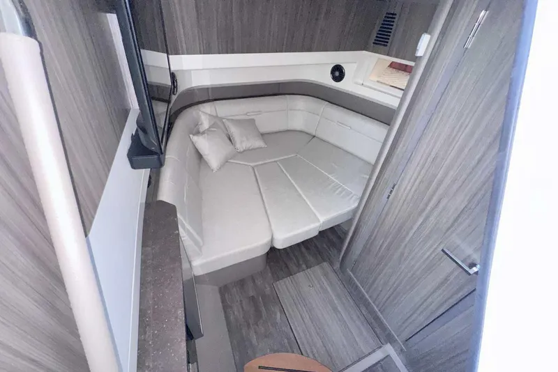 Slide: The Image of 2024 Sea Ray SLX 400 cabin interior with modern design and comfortable seating. - 43