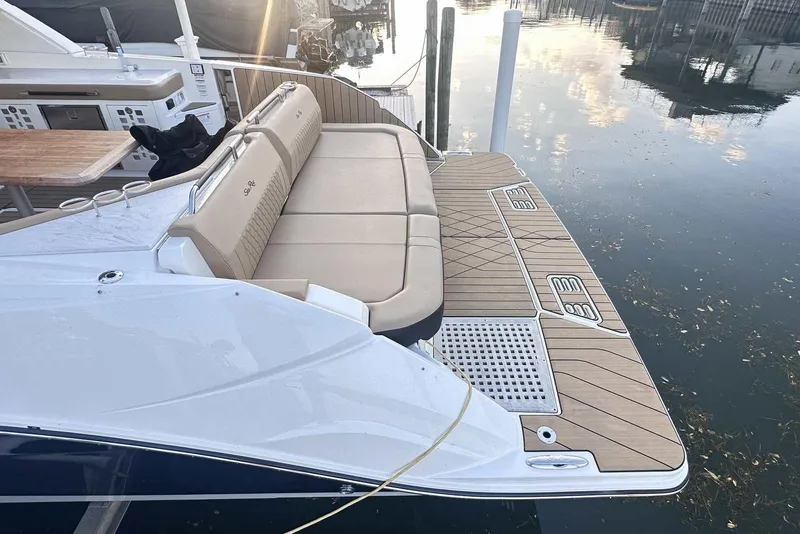 Slide: The Image of 2024 Sea Ray SLX 400 boat with spacious deck and luxurious seating. - 5