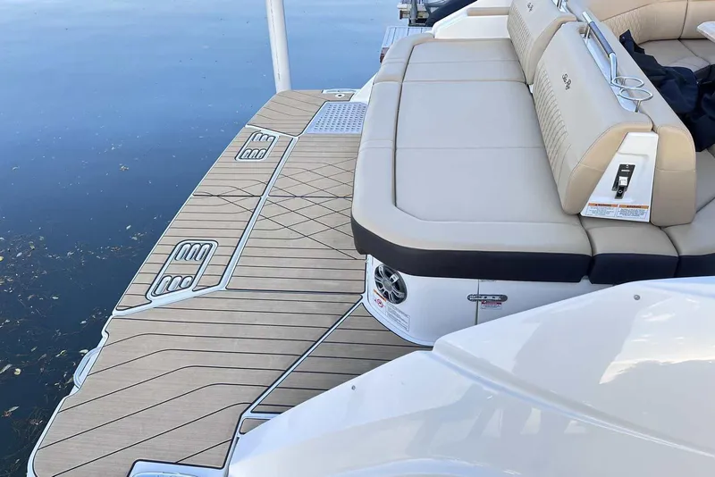 Slide: The Image of 2024 Sea Ray SLX 400 boat with spacious deck and luxurious seating. - 9