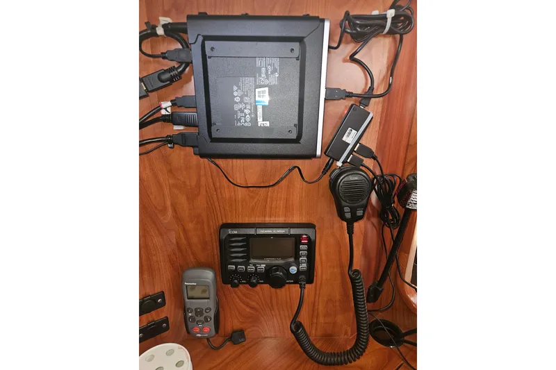 Slide: The Image of 2013 Marlow-Hunter 50 aft cabin yacht cockpit with steering wheel and navigation equipment. - 12