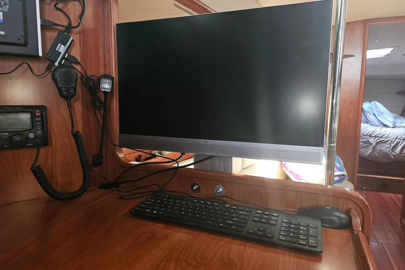 Slide: The Image of Steering wheel and navigation controls on 2013 Marlow-Hunter 50 aft cabin yacht. - 13