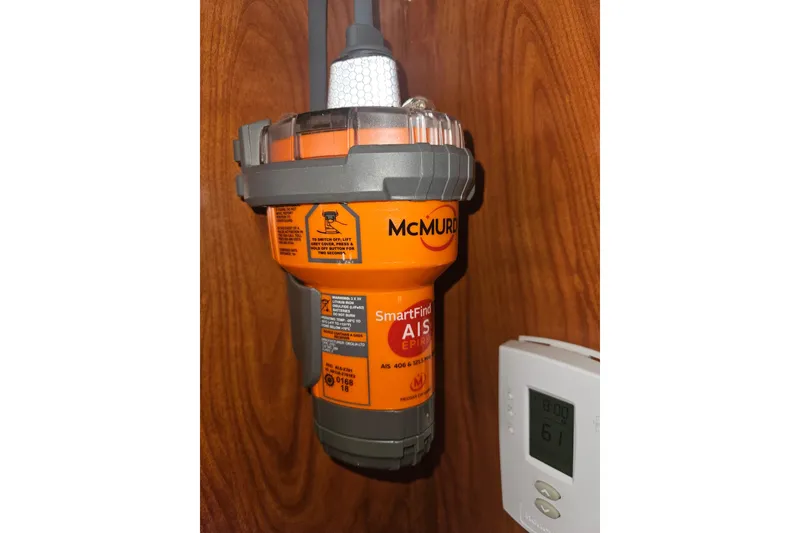 Slide: The Image of 2013 Marlow-Hunter 50 aft cabin yacht cockpit with navigation equipment and steering wheel. - 18