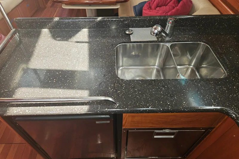 Slide: The Image of Rope and cleat system on 2013 Marlow-Hunter 50 aft cabin sailboat deck. - 21