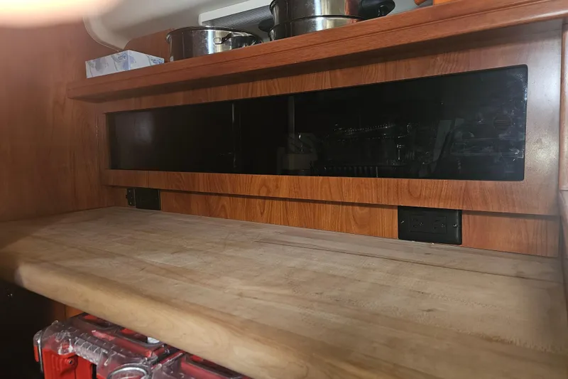 Slide: The Image of 2013 Marlow-Hunter 50 aft cabin kitchen with dual Nova Kool refrigerators. - 28