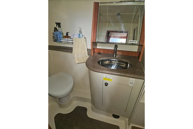 Slide: The Image of 2013 Marlow-Hunter 50 aft cabin with cozy bed and wooden interior. - 33