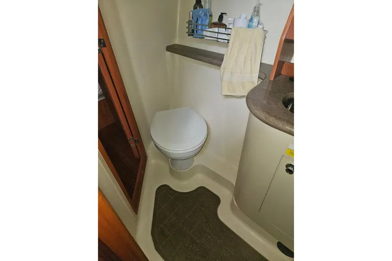 Slide: The Image of Wooden cabinetry in 2013 Marlow-Hunter 50 aft cabin, featuring sleek design and polished finish. - 35