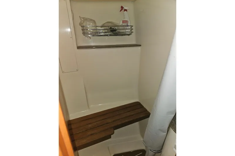 Slide: The Image of Wooden cabinetry and fire extinguisher in 2013 Marlow-Hunter 50 aft cabin interior. - 38