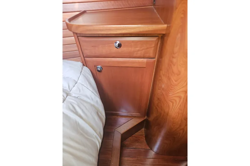 Slide: The Image of Wooden interior of 2013 Marlow-Hunter 50 aft cabin with countertop and storage. - 42